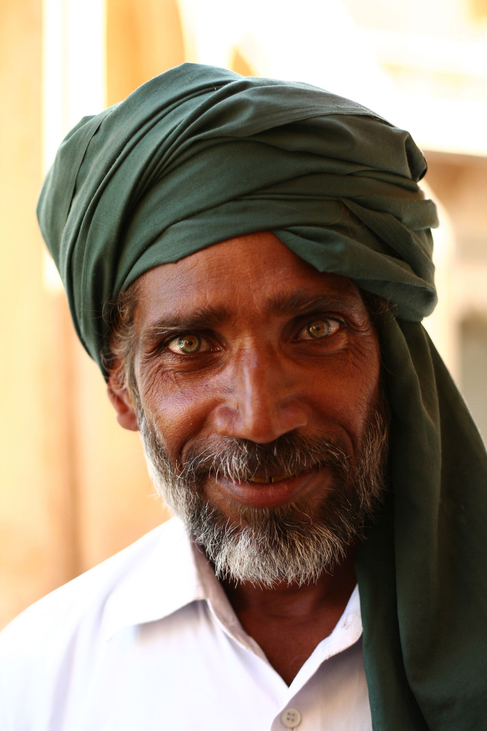 Portrait of a man wearing a green turban